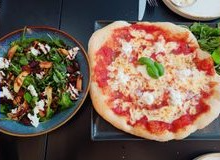 Pizza and salad seen from above